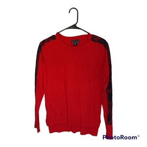 I know you will love this red sweater with black lace detail.